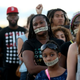 Demonstrators stand with tape reading, “I Can’t Breathe” as they march along Interstate 195 to protest police abuse on Dec. 7, 2014, in Miami.
Joe Raedle/Getty Images